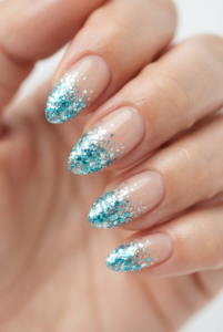 chunky-aqua-glitter-tip-almond-nails